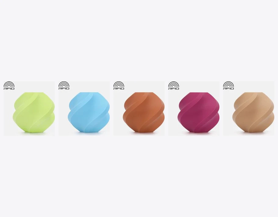 A lineup of Bambu Lab PLA Matte twist vases in green, ice blue, latte brown, magenta and tan