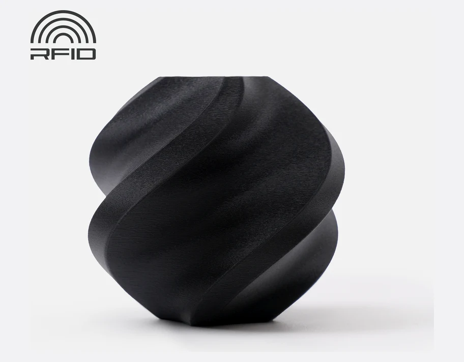 Bambu Lab PLA Matte printed twist vase in Charcoal with an RFID spool badge