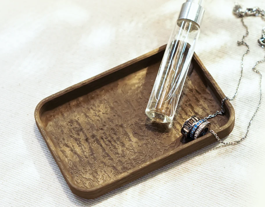 A 3D-printed Bambu Lab PLA Wood tray with a realistic grainy wood texture